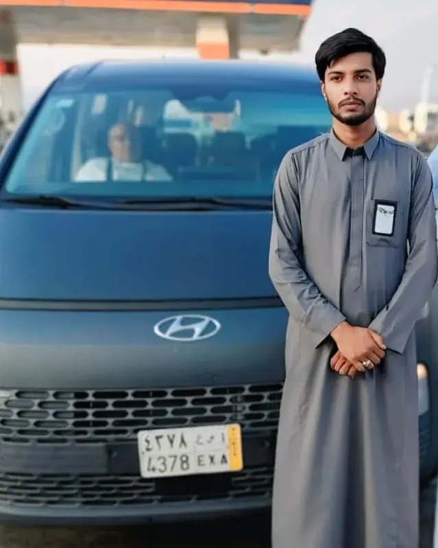 Mohsin Ali, Al Haram Cabs driver, with a Hyundai Staria